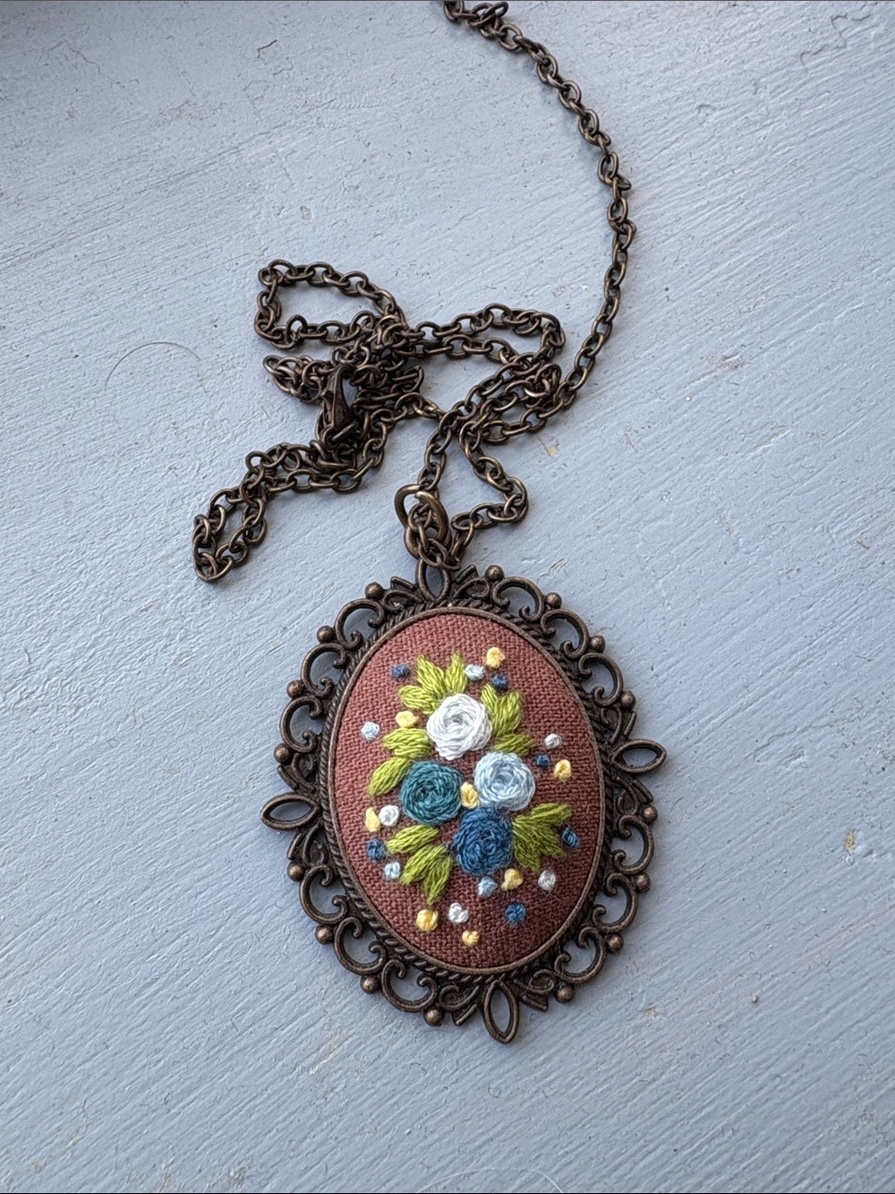Hand-Embroidered Floral Pendant Necklace in Brown and Blue
